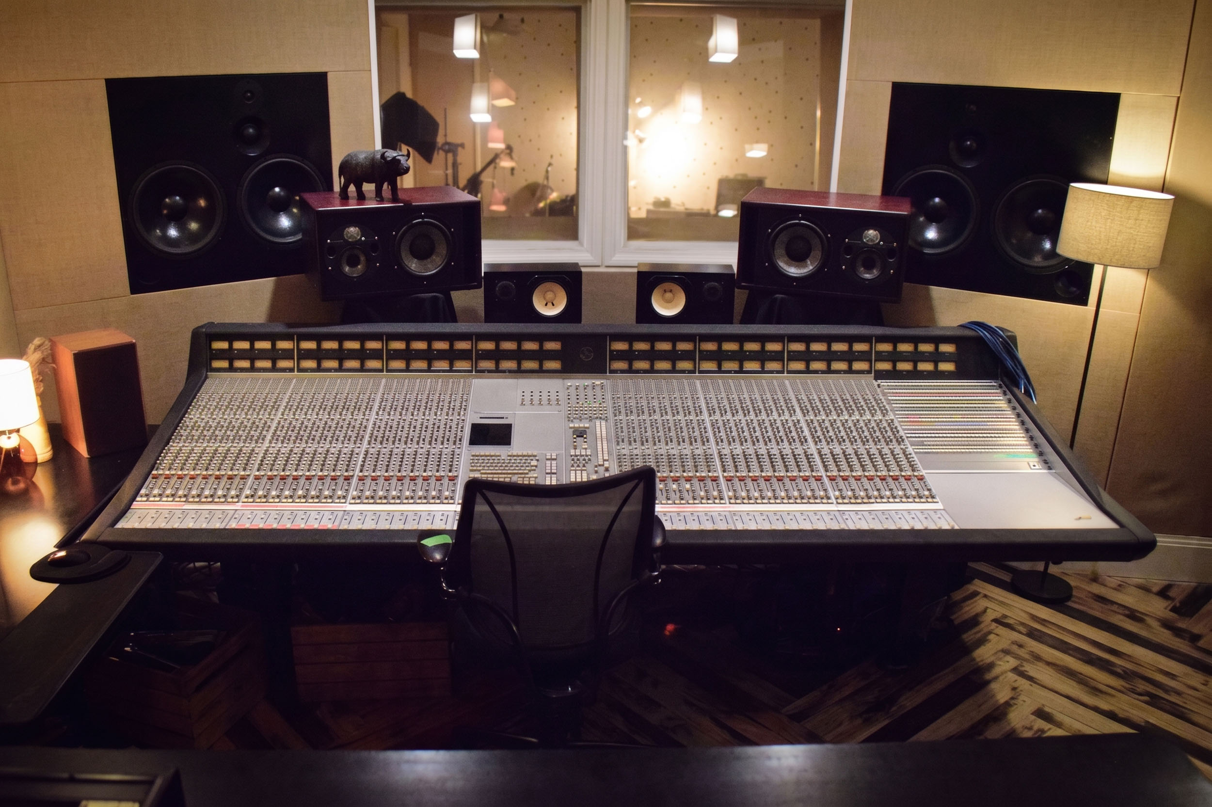 Head-on view of the SSL mixing console and monitors in the ONLYMIXING control room