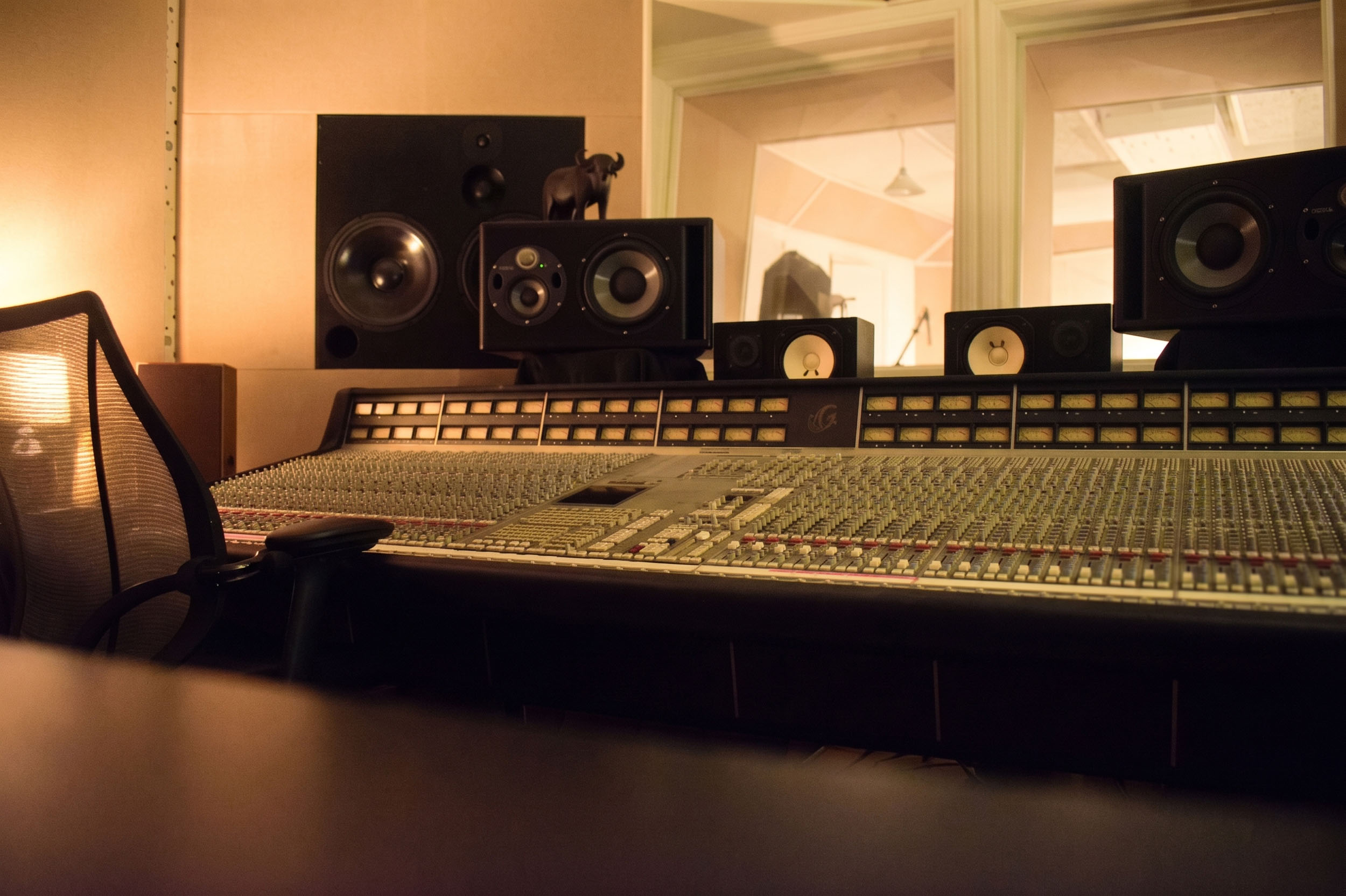 Low-angle view of the SSL G-series mixing console at the ONLYMIXING studio
